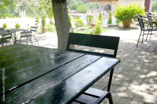 Table with chairs at summer garden