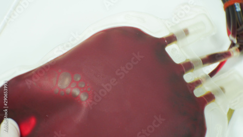 Red blood on blood bag in laboratory.