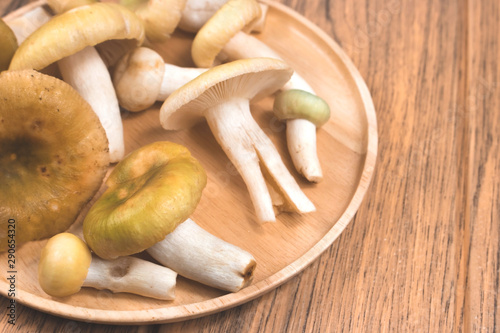 fresh mushrooms in a wooden bowl