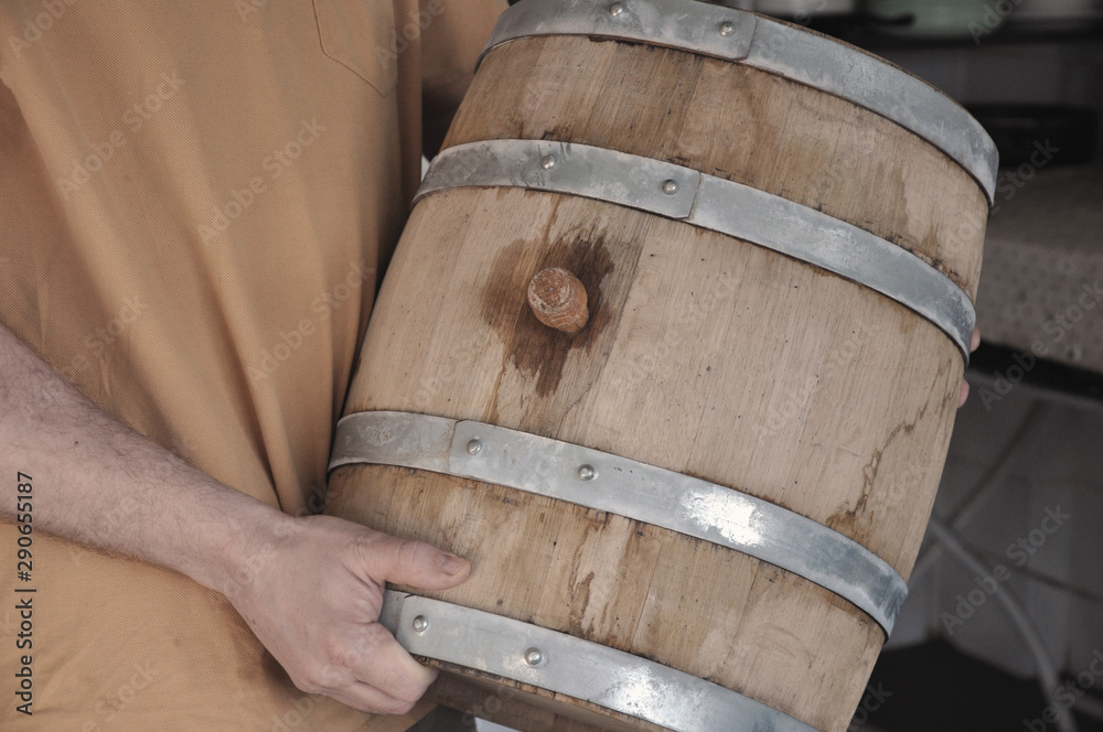New oak barrel with young wine, transported to storage.