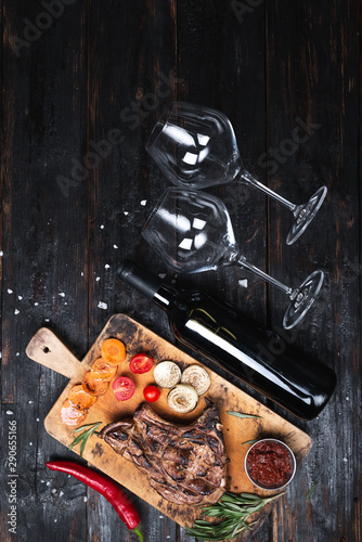 Εκτύπωση καμβά juicy piece of well-done steak on a cutting board, grilled vegetables,