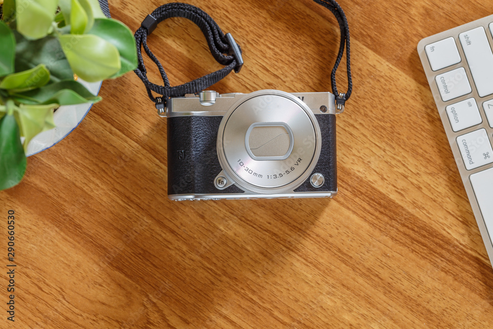top view of retro camera on wooden table.. top view of retro camera on wooden table..