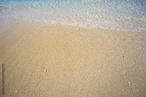 beautiful sandy beach and soft blue ocean wave