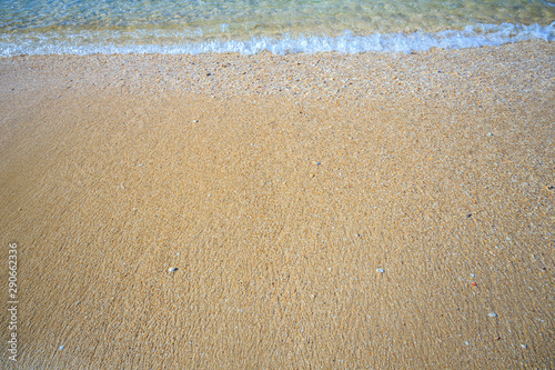 beautiful sandy beach and soft blue ocean wave