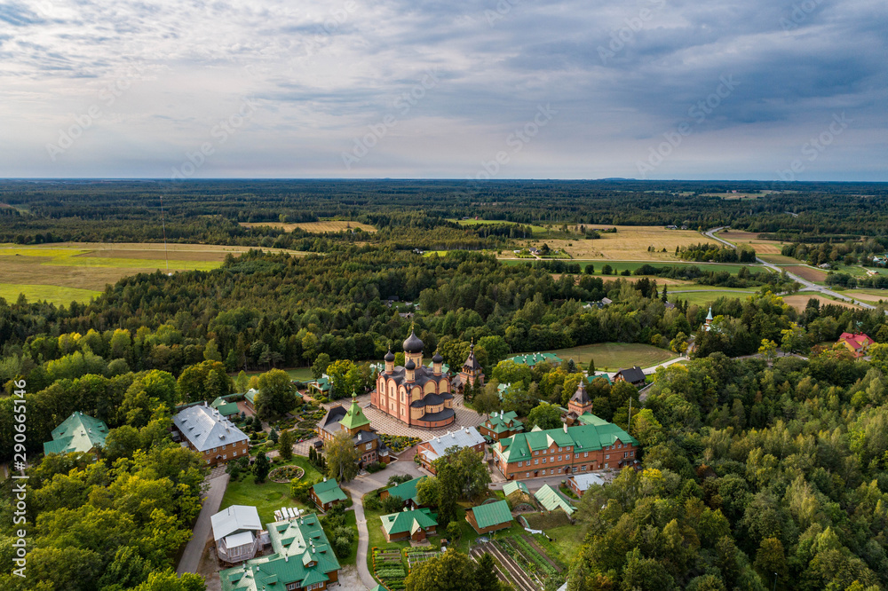Aerial view of  a small Orthodox Christian church was built in Pühtitsa.  Pühtitsa Convent is a Russian Orthodox convent in Eastern Estonia between Lake Peipus and the Gulf of Finland.