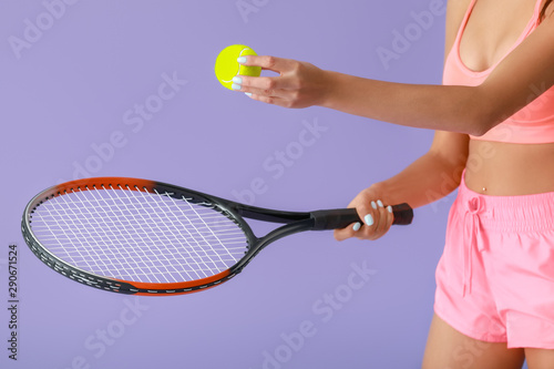 Female tennis player servin...