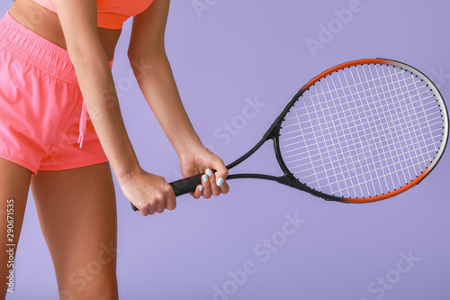 Female tennis player on color background © Pixel-Shot