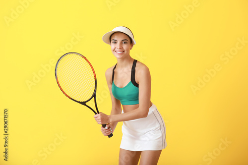 Beautiful tennis player on color background © Pixel-Shot