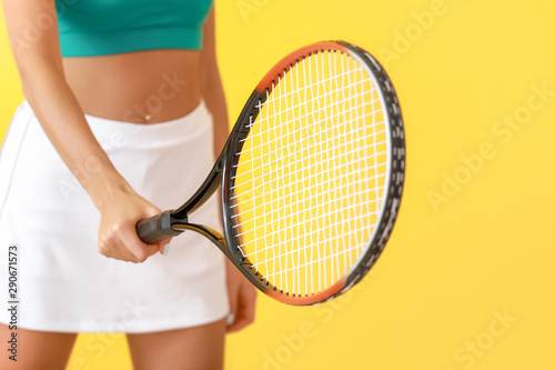 Beautiful tennis player on color background, closeup © Pixel-Shot