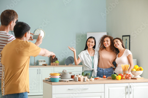 Men taking photo of their f...
