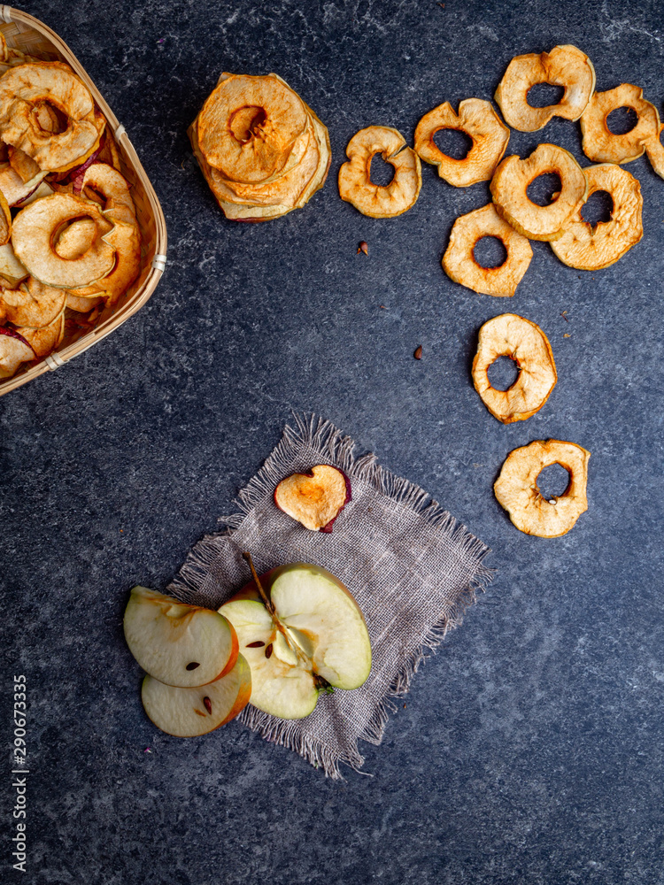 Naklejka premium vegetarian dries apples, dehydrated healthy snack chips, copy space