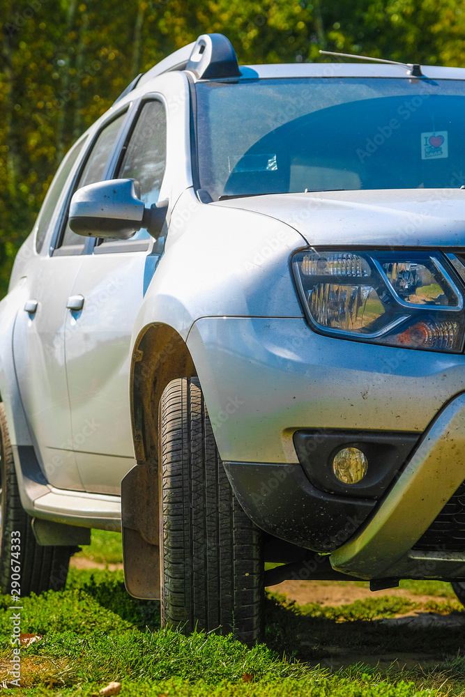 Moscow region, Russia - September, 8, 2019: the image of a car parking on a country road in Moscow region Moscow region, Russia - September, 8, 2019: the image of a car parking on a country road in Moscow region