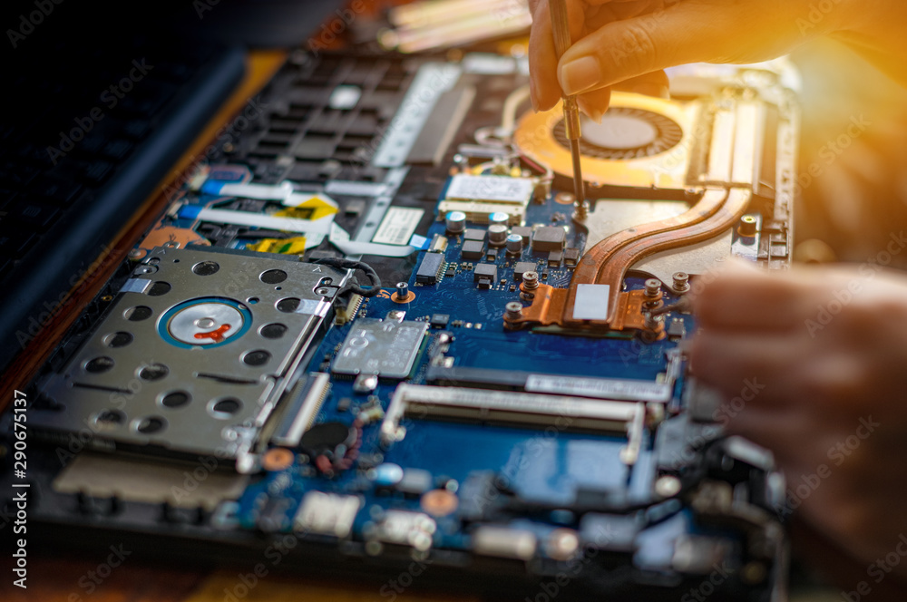 Technician repairing broken laptop notebook computer Technician repairing broken laptop notebook computer