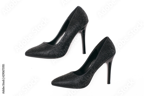 Black high heels shoes with artificial rhinestones isolated on white background.