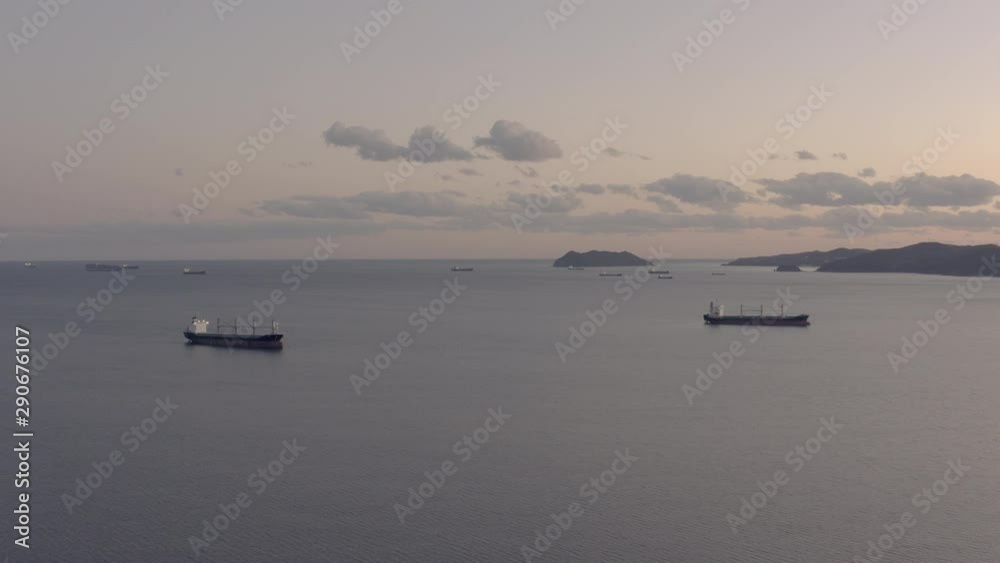 General cargo ships at the anchorage in the evening, Far East, Russia General cargo ships at the anchorage in the evening, Far East, Russia