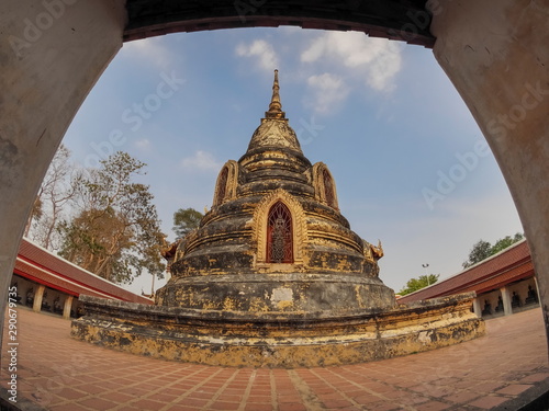 view of ancient padoga or chedi with blue sky background, Wat Khanon Nang Yai, Amphur Photharam, Ratchaburi Province, Thailand. photo