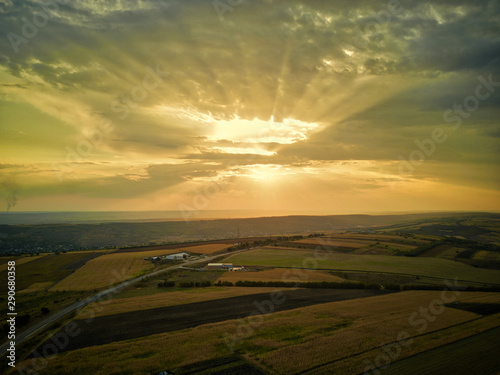 Aerial drone view of grain fields, wheat during golden sunset. Agricultural pattern. Moldova republic of.