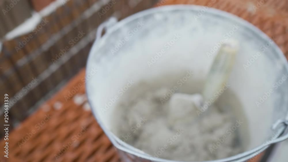 Construction equipment for brick building work trowel. The construction of a brick house. Worker builds a house of brick. Brick walls. Brick with holes Construction equipment for brick building work trowel. The construction of a brick house. Worker builds a house of brick. Brick walls. Brick with holes