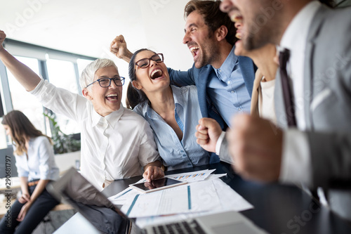 Business team celebrating a...