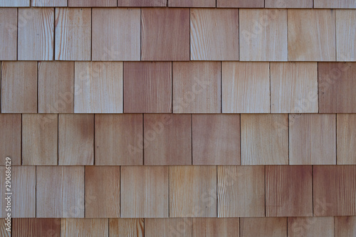 Facade with rectangular wooden shingles at a house in the Alps, switzerland, europe