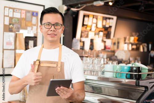 Young asian men barista get orders at the coffee shop,start up small business owner food and drink concept.