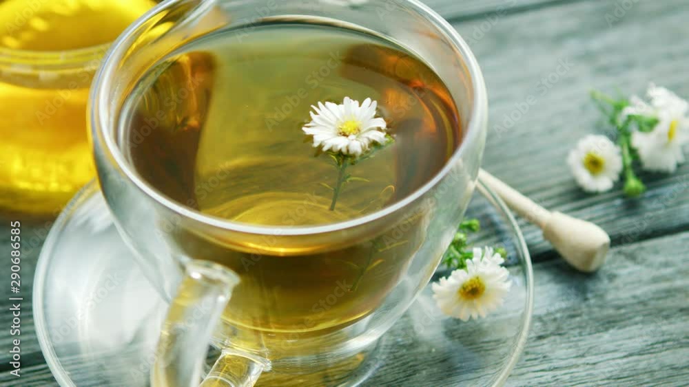 Closeup of cup with camomile tea