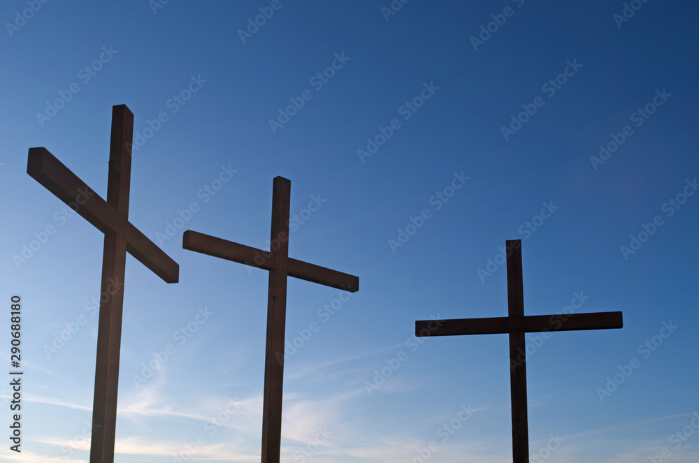 three crosses against blue sky