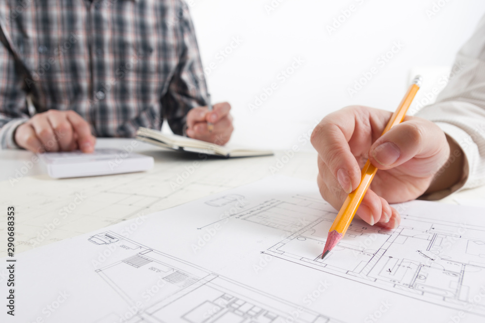 Architects working on blueprint. Architects workplace. Construction concept. Engineering tools. Architects working on blueprint. Architects workplace. Construction concept. Engineering tools.