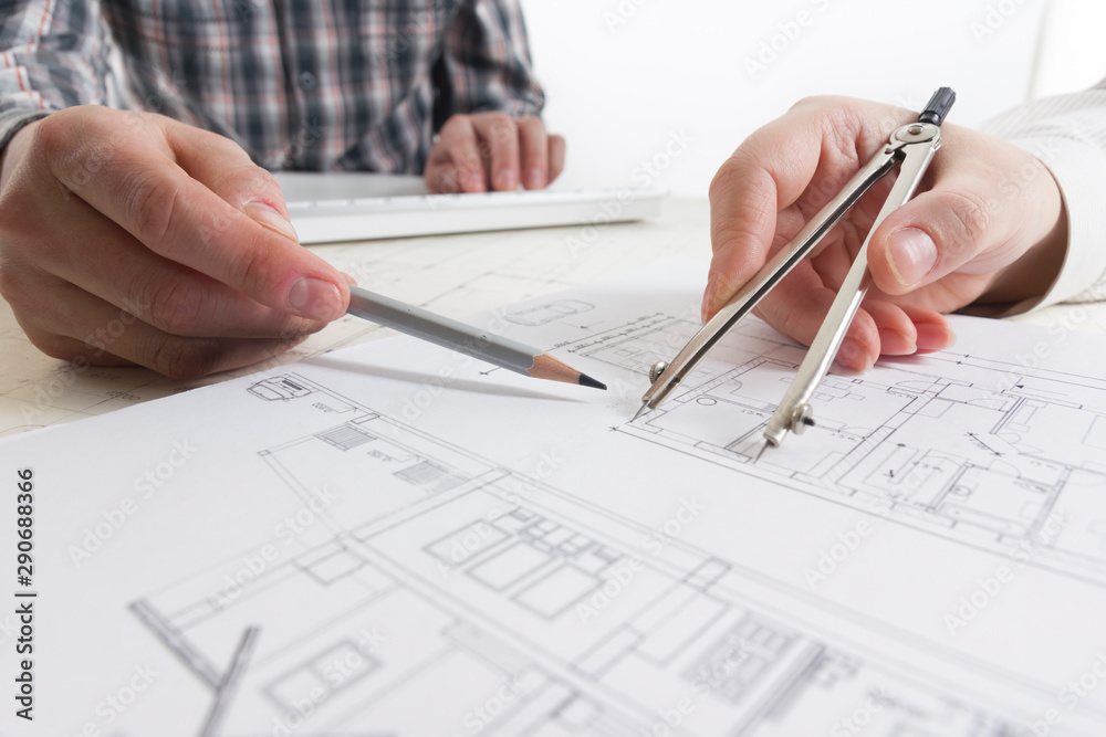 Architects working on blueprint. Architects workplace. Construction concept. Engineering tools. Architects working on blueprint. Architects workplace. Construction concept. Engineering tools.