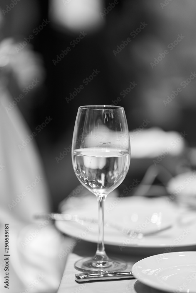 a glass of champagne on holiday. Close-up. Black and white.