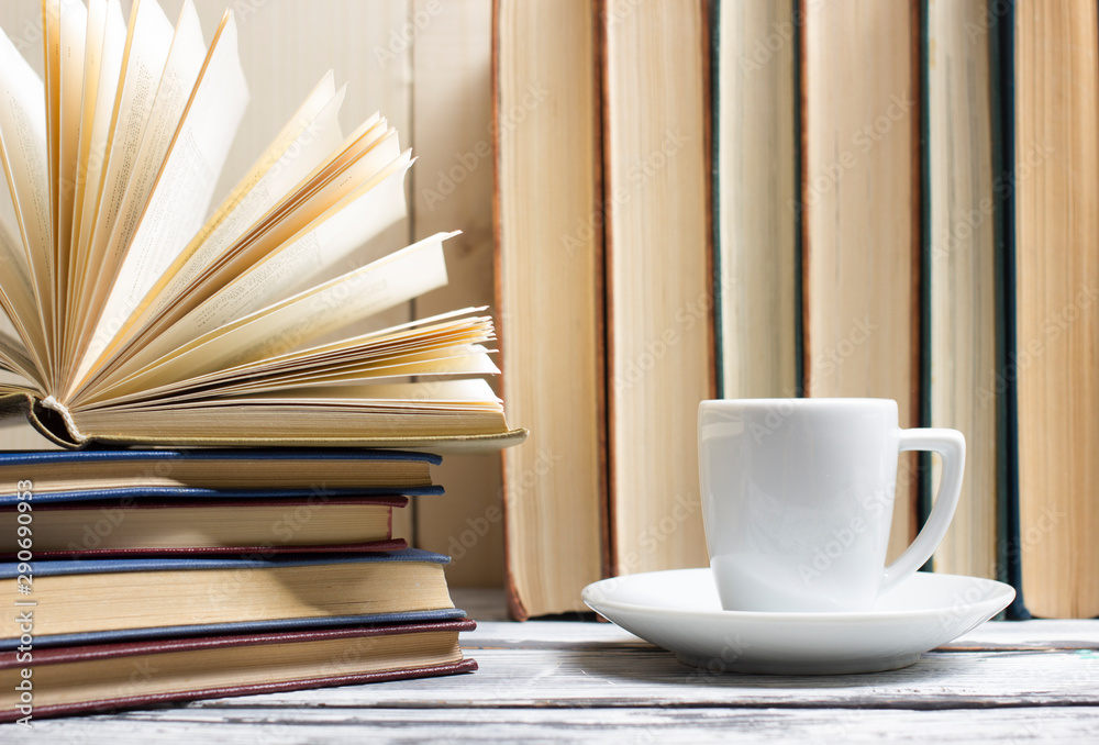 Open book, hardback books on wooden table. Back to school. Copy space Open book, hardback books on wooden table. Back to school. Copy space