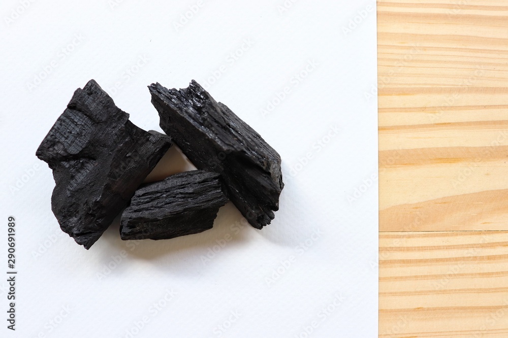 carbon and bamboo charcoal soap on wood background