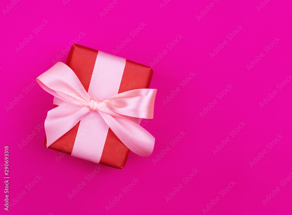 Gift box on a beautiful background with a satin ribbon. Holiday Concept