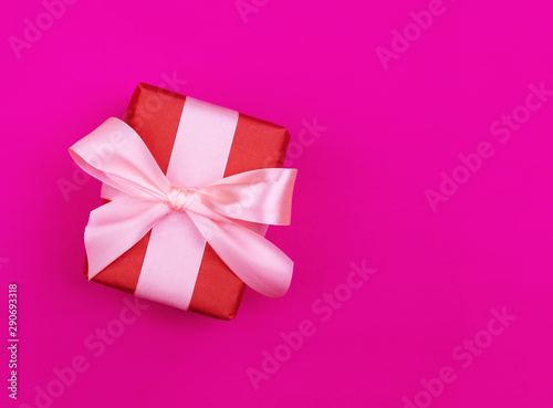 Gift box on a beautiful background with a satin ribbon. Holiday Concept