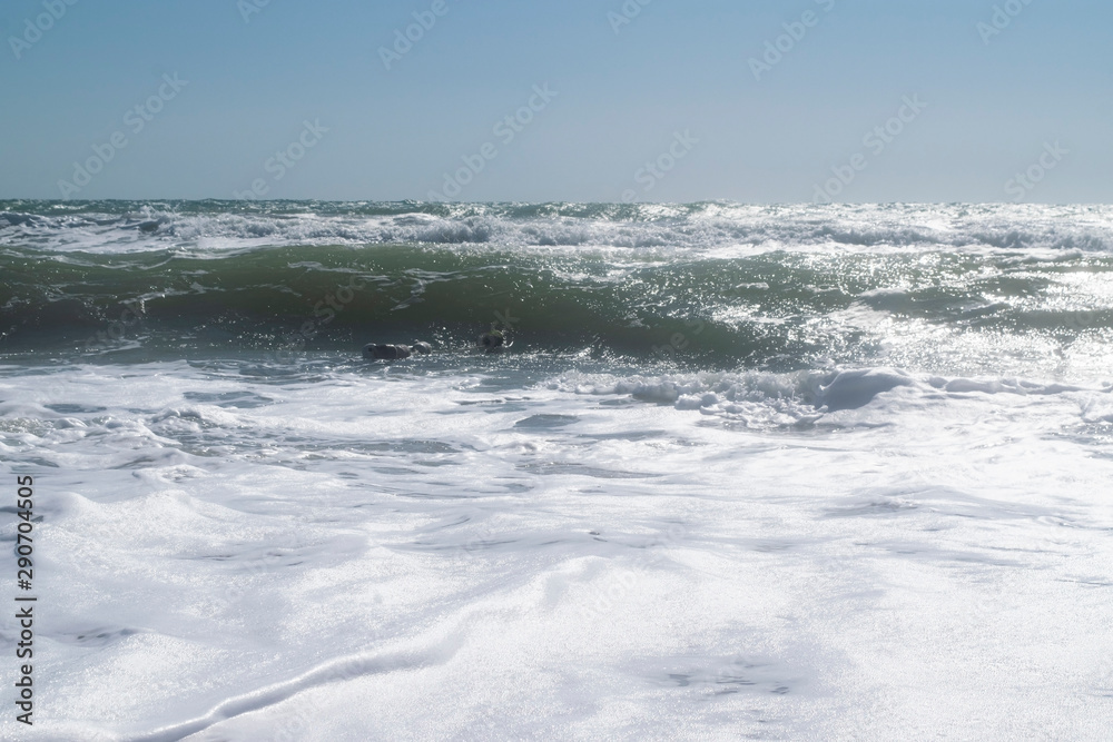 Black Sea. Summer storm. Waves lapping at the sandy beach.