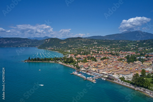 Aerial photography. Beautiful coastline. In the city of Bardolino  Lake Garda is the north of Italy. View by Drone. Docked yachts parking in Port.