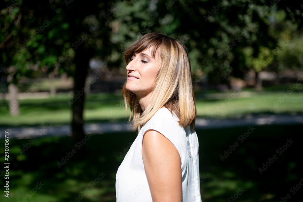 Pretty woman posing in the park Pretty woman posing in the park