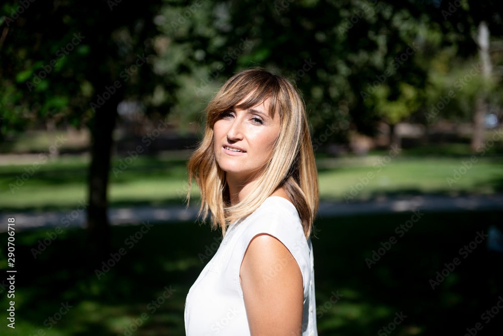 Pretty woman posing in the park Pretty woman posing in the park