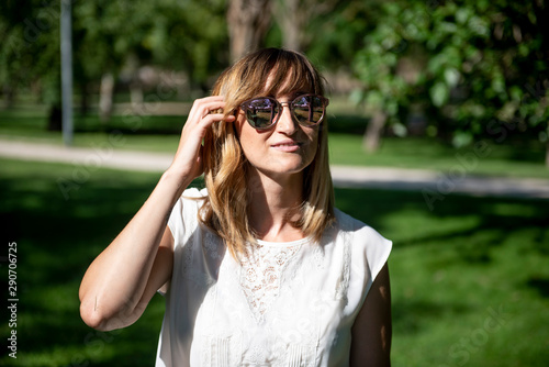 Pretty woman posing in the park