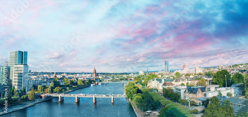 Aerial flying along the futuristic skyline the business and financial centre of Frankfurt am Main  sunset panoramic view from drone