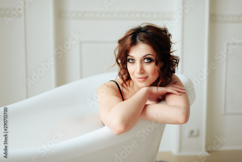 beautiful girl in the bathtub water in underwear