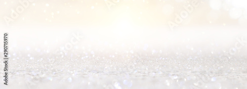 abstract backgrounf of glitter vintage lights . silver and white. de-focused. banner © tomertu