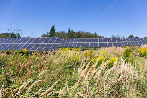 Fototapeta Naklejka Na Ścianę i Meble -  Solar Power Station on the summer Meadow 