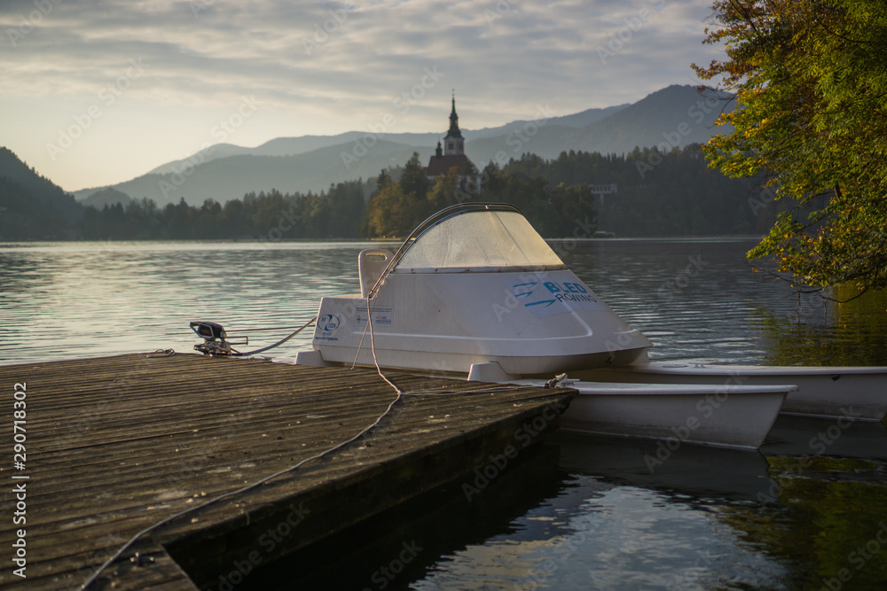 Fototapeta premium Travailing around Lake Bled In Slovenia an amazing lake full of impressive nature , crystal blue water with a beautiful island in the middle surrounded by those beautiful mountains and trees. 