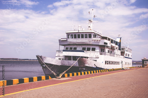 Tourist boat in the waterfront harbor. photo