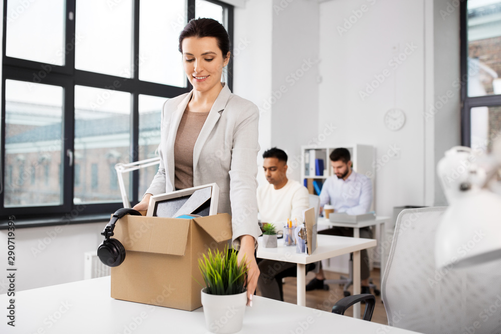 business, new job and corporate concept - happy smiling businesswoman with her personal stuff at office business, new job and corporate concept - happy smiling businesswoman with her personal stuff at office