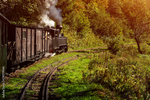 Coal wood burning steam locomotive of Mocanita, popular tourist attraction in Maramures, Romania photo