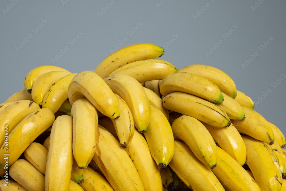 Bananas on the grey isolated background