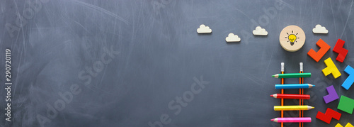 Fotografija Education concept of Ladder made from pencils next to clouds over blackboard