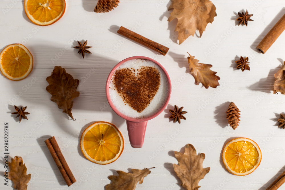 Dry yellow leaves, spice, coffee with heart pattern on the table, good morning is the best start day. Autumn mood background, copy space. Dry yellow leaves, spice, coffee with heart pattern on the table, good morning is the best start day. Autumn mood background, copy space.